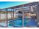 Screened pool with patio furniture and outdoor kitchen at 316 Amanda Ln, Leesburg, FL 34748