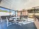 Relaxing screened patio with seating and hot tub at 316 Amanda Ln, Leesburg, FL 34748