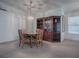 Cozy dining room with wood furniture and a built-in hutch at 32619 Oak Park Dr, Leesburg, FL 34748