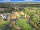 Aerial view showcasing property's expansive lot and lake at 4235 Dove Valley Ln, Lady Lake, FL 32159