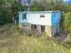 Small, damaged house needing significant repairs at 4235 Dove Valley Ln, Lady Lake, FL 32159