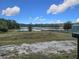 Scenic lakefront lot with a tranquil view, ready for your dream home at 4235 Dove Valley Ln, Lady Lake, FL 32159