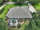 Single-Gathering home with tile roof, screened patio, and landscaped yard at 6147 Spinnaker Loop, Lady Lake, FL 32159