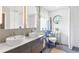 Modern bathroom with double sinks, stylish cabinetry, and a decorative mirror at 6147 Spinnaker Loop, Lady Lake, FL 32159