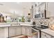 Updated kitchen with stainless steel appliances and a breakfast bar at 6147 Spinnaker Loop, Lady Lake, FL 32159