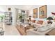 Living area with comfortable seating and a view of the back yard at 6147 Spinnaker Loop, Lady Lake, FL 32159