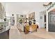 Living room with comfortable seating, large windows, and an open floor plan at 6147 Spinnaker Loop, Lady Lake, FL 32159