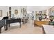 Spacious living room with hardwood floors, a fireplace, and large windows at 6147 Spinnaker Loop, Lady Lake, FL 32159