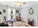 Cozy living room with built-in shelving and a charming window seat at 6147 Spinnaker Loop, Lady Lake, FL 32159