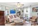 Bright living room featuring a comfy sofa and decorative accents at 6147 Spinnaker Loop, Lady Lake, FL 32159