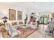 Open floor plan living room with seating area and fireplace at 6147 Spinnaker Loop, Lady Lake, FL 32159