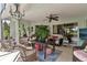 Relaxing screened patio perfect for outdoor dining and entertaining at 6147 Spinnaker Loop, Lady Lake, FL 32159