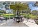 Inviting screened patio overlooking a tranquil golf course view at 6147 Spinnaker Loop, Lady Lake, FL 32159
