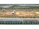Aerial view of townhomes under construction near a highway at 8512 Magnificent Ln, Groveland, FL 34736