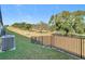 Backyard with a view of trees and a fence at 8512 Magnificent Ln, Groveland, FL 34736