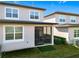 Two-story townhome with screened patio and small backyard at 8512 Magnificent Ln, Groveland, FL 34736