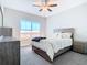Bedroom with a queen bed and large window at 8512 Magnificent Ln, Groveland, FL 34736