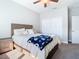 Bedroom with a queen bed and double doors closet at 8512 Magnificent Ln, Groveland, FL 34736
