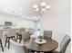 Bright dining area with kitchen and living room views at 8512 Magnificent Ln, Groveland, FL 34736