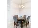Cozy dining area with a round table and four gray chairs at 8512 Magnificent Ln, Groveland, FL 34736