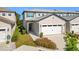 Townhome exterior showcasing a front entrance and garage at 8512 Magnificent Ln, Groveland, FL 34736