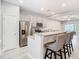 Modern kitchen with stainless steel appliances and island at 8512 Magnificent Ln, Groveland, FL 34736