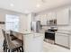 Modern kitchen with stainless steel appliances and granite countertops at 8512 Magnificent Ln, Groveland, FL 34736