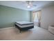 Bedroom with ceiling fan, window, and an accent wall at 941 Eastmont Ct, The Villages, FL 32162