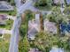 Aerial view of single Gathering home with a large backyard and screened enclosure at 1001 Amarillo Pl, The Villages, FL 32159