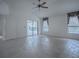 Living room with tile floors, ceiling fan and patio access at 1001 Amarillo Pl, The Villages, FL 32159