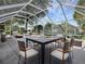 Relaxing screened patio with outdoor furniture at 1001 Amarillo Pl, The Villages, FL 32159