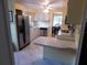 Eat-in kitchen featuring stainless steel appliances and ample counter space at 117 Hibiscus Way, Leesburg, FL 34748