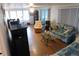 Bright living room with laminate flooring and neutral color palette at 117 Hibiscus Way, Leesburg, FL 34748