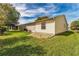 Nice backyard with green grass at 1233 Carvello Dr, The Villages, FL 32162
