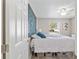 Cozy guest bedroom with a queen bed and window at 1233 Carvello Dr, The Villages, FL 32162