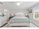 Well-lit bedroom featuring a comfortable queen-size bed at 1233 Carvello Dr, The Villages, FL 32162