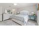 Main bedroom with a queen bed, updated flooring, and dresser at 1233 Carvello Dr, The Villages, FL 32162
