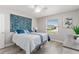 Guest bedroom with a queen bed and large window at 1233 Carvello Dr, The Villages, FL 32162