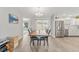 Dining area with a live-edge wood table and modern chairs at 1233 Carvello Dr, The Villages, FL 32162