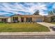 Attractive single-story home with landscaping at 1233 Carvello Dr, The Villages, FL 32162