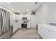 Modern kitchen with white cabinets and stainless steel appliances at 1233 Carvello Dr, The Villages, FL 32162