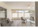 Relaxing sunroom with seating and ceiling fan at 1233 Carvello Dr, The Villages, FL 32162