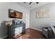 Bedroom with dresser, comfy chair, and hardwood floor at 1239 Alapaha Ln, Orlando, FL 32828