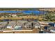 Aerial view of homes near a lake with lush landscaping at 1270 Stratton Ave, Groveland, FL 34736