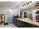 Double vanity bathroom with a large shower and modern fixtures at 1270 Stratton Ave, Groveland, FL 34736