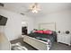 Main bedroom with plush bed, large windows, and en-suite bathroom at 1270 Stratton Ave, Groveland, FL 34736
