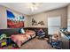 bedroom featuring a motocross theme and built-in shelving at 1270 Stratton Ave, Groveland, FL 34736