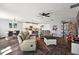 Open living room featuring a cozy seating area and hardwood floors at 1270 Stratton Ave, Groveland, FL 34736