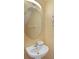 Small bathroom with pedestal sink, oval mirror, and decorative seahorse accents at 151 Rubino Dr, Davenport, FL 33837