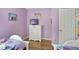 Two twin beds, dresser, and TV in a playfully decorated bedroom at 151 Rubino Dr, Davenport, FL 33837